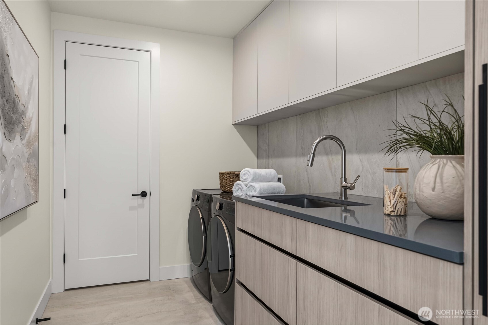 Laundry with sink and appliances