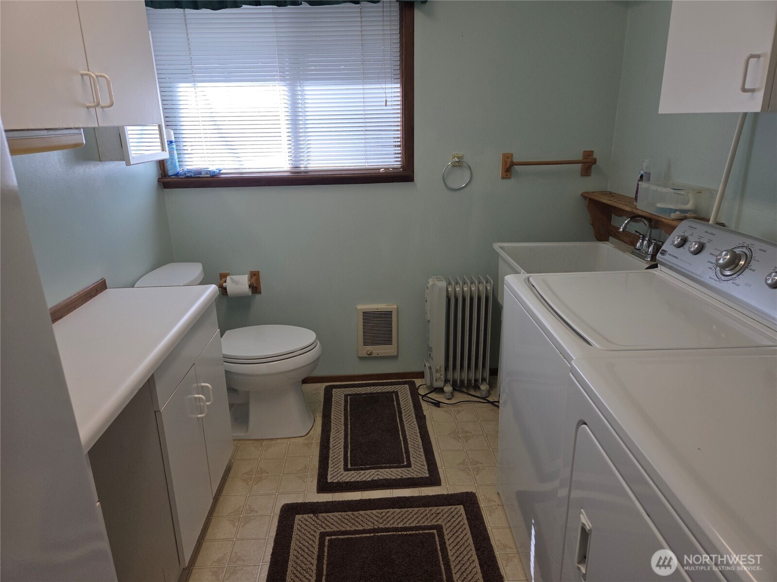 Laundry room, with half bath and extra storage