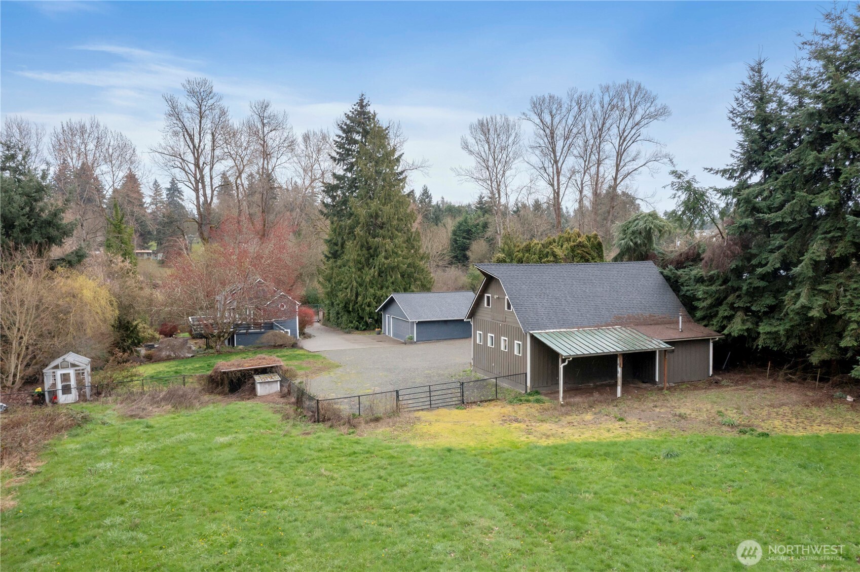 Detached 24x30 finished garage with 24x36 shop on over two acres.
