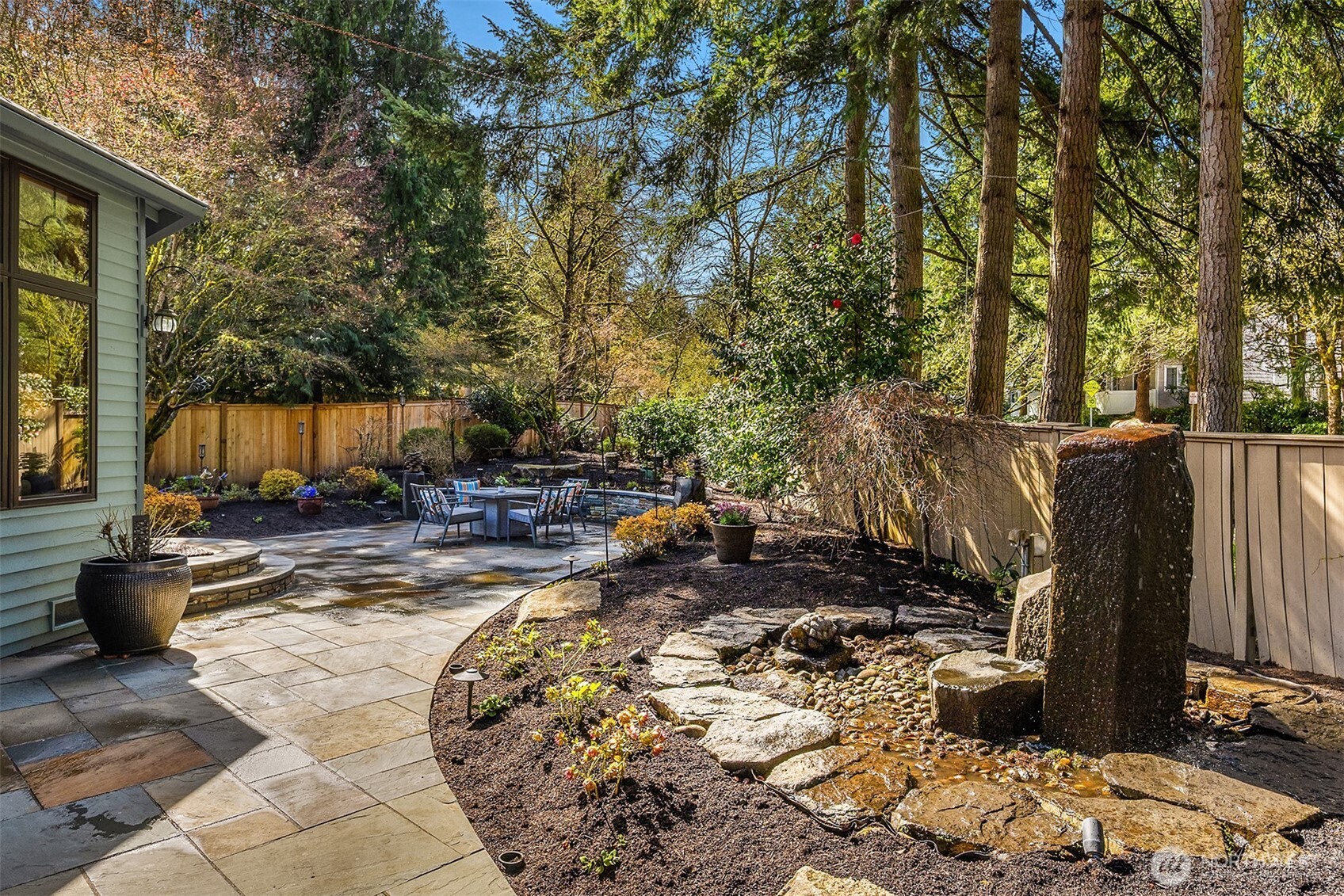 Water Feature Adjacent to Custom Stone Patio