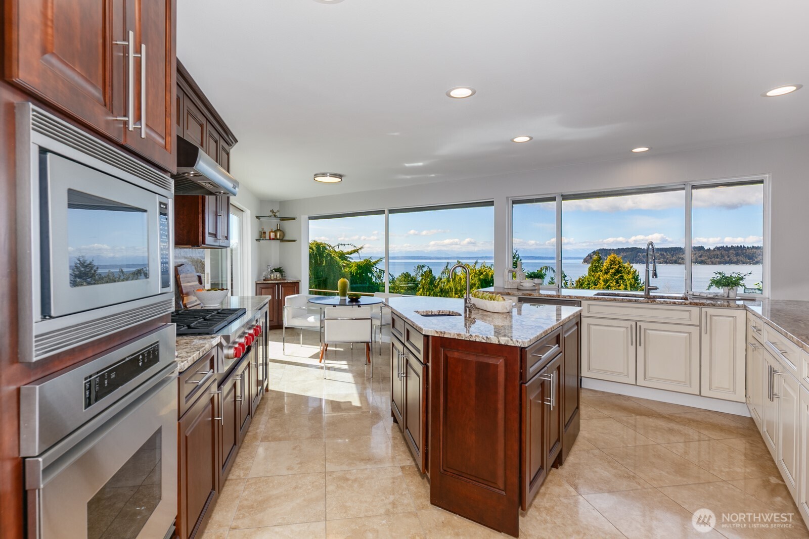 Enjoy the view from every location in the island kitchen. All new flooring, cabinets, counters & appliances.