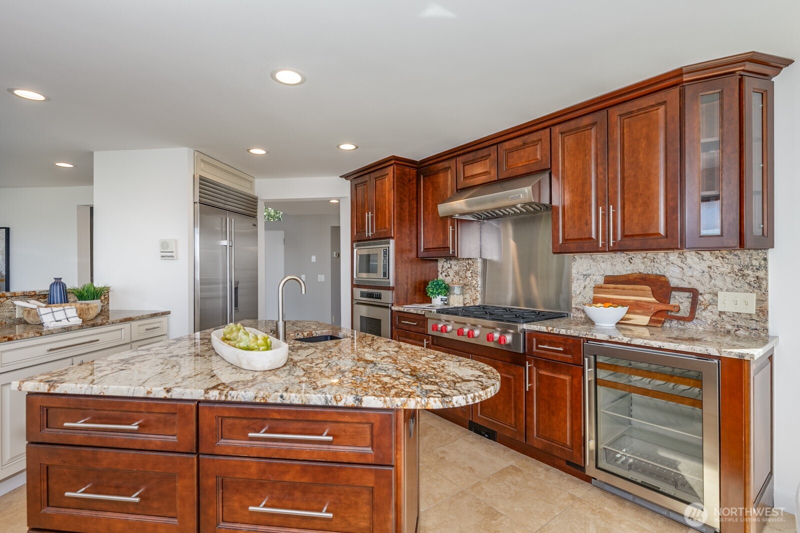 All SS appliances. Dacor, Sub Zero, Wolf, GE Profile. Note the wine fridge.