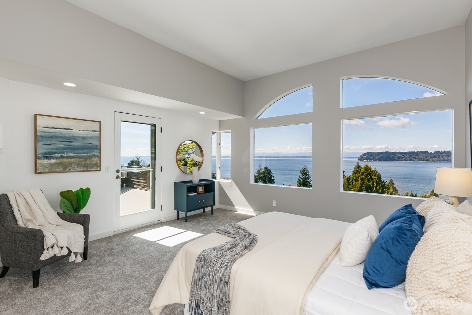 You can lay in bed and enjoy the views! Possession Point, the south tip of Whidbey Island, is front and center. The door goes from the primary bedroom to the view deck.