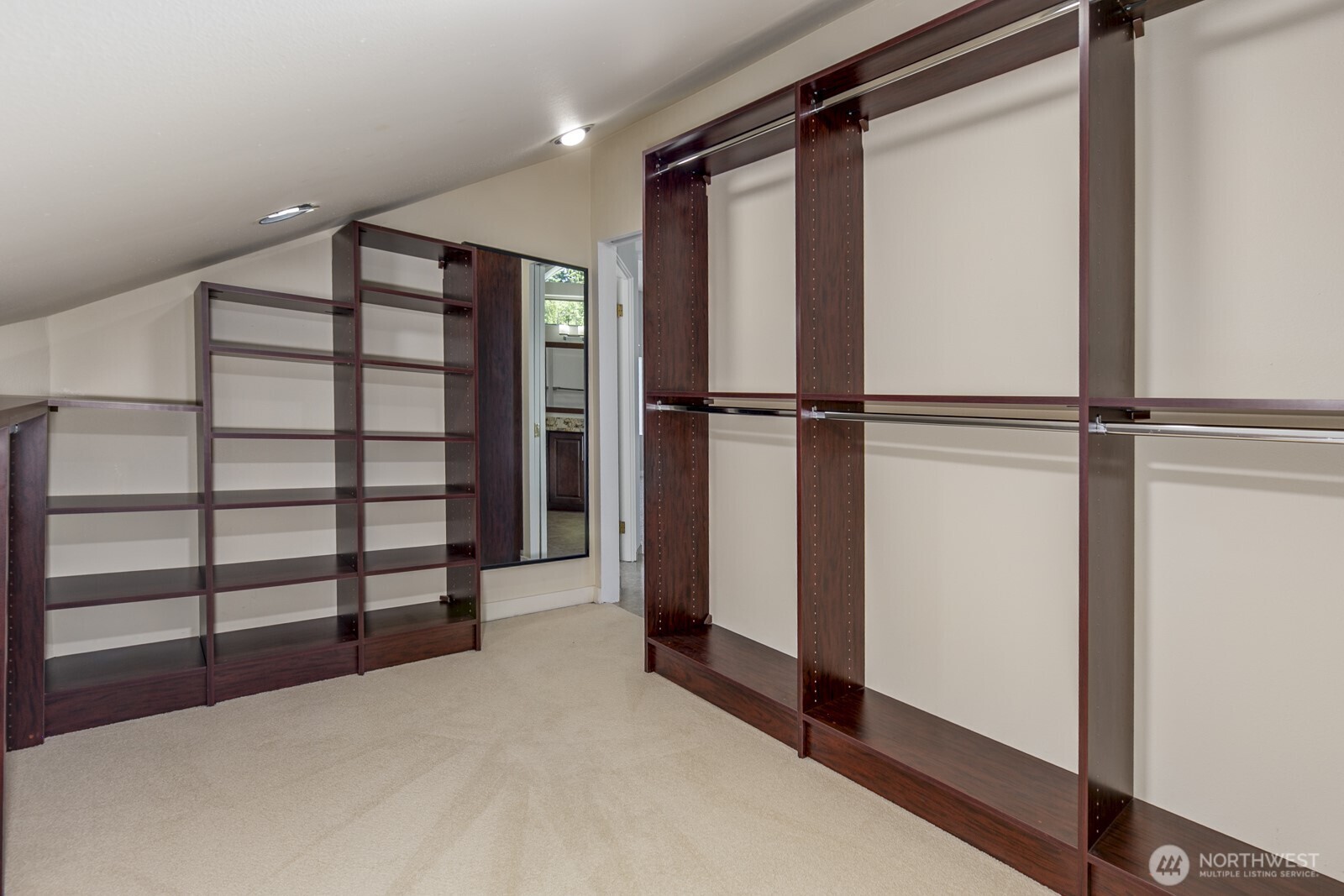 The walk in closet with custom built ins.