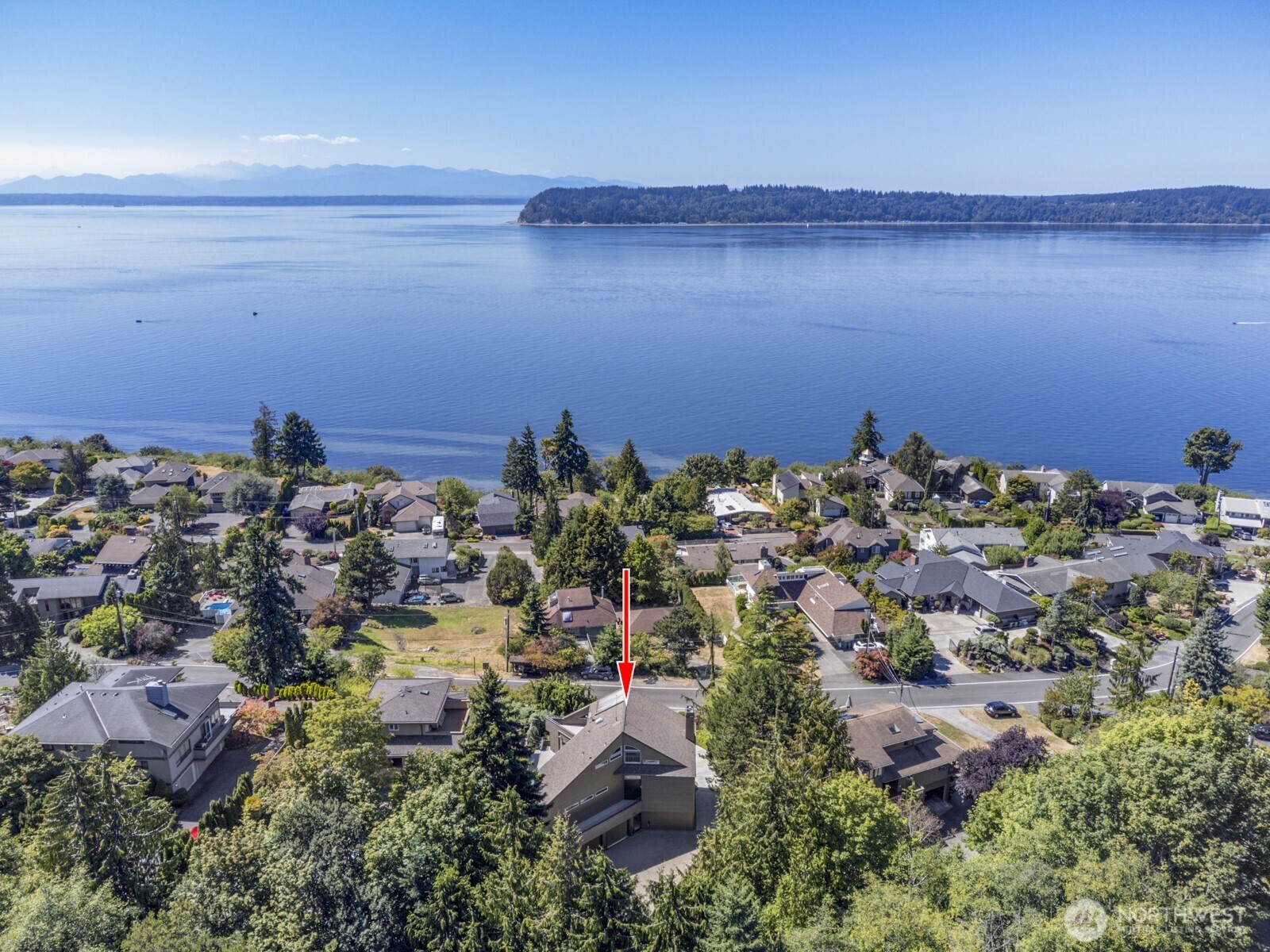 Located in the heart of the coveted Chennault Beach neighborhood. The home looks due west to Possession Point on Whidbey Island, across the shipping lanes of Admiralty Inlet to the Olympic Range in the distance.