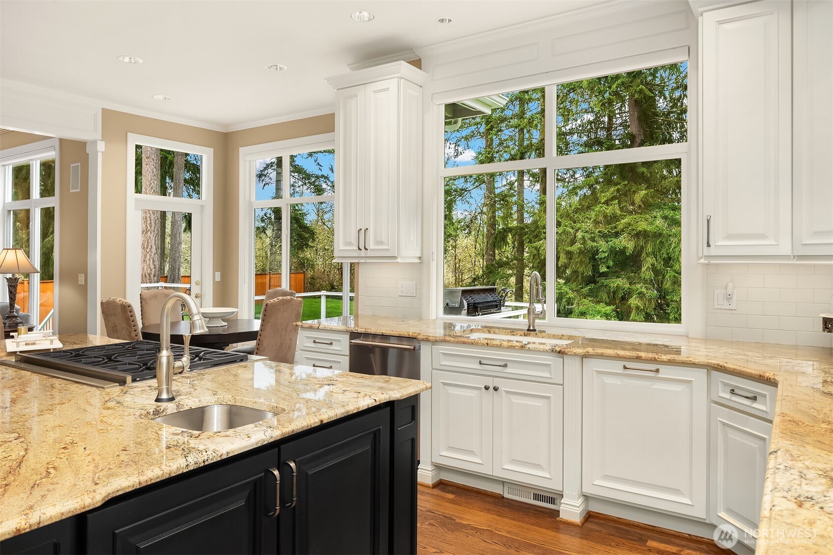 Gorgeous, spotless, expanded and remodeled Chef's kitchen ~ granite counters, huge island, eating bar, 6-burner Wolfe range, double ovens, SubZero fridge and abundant cabinet & counter space.