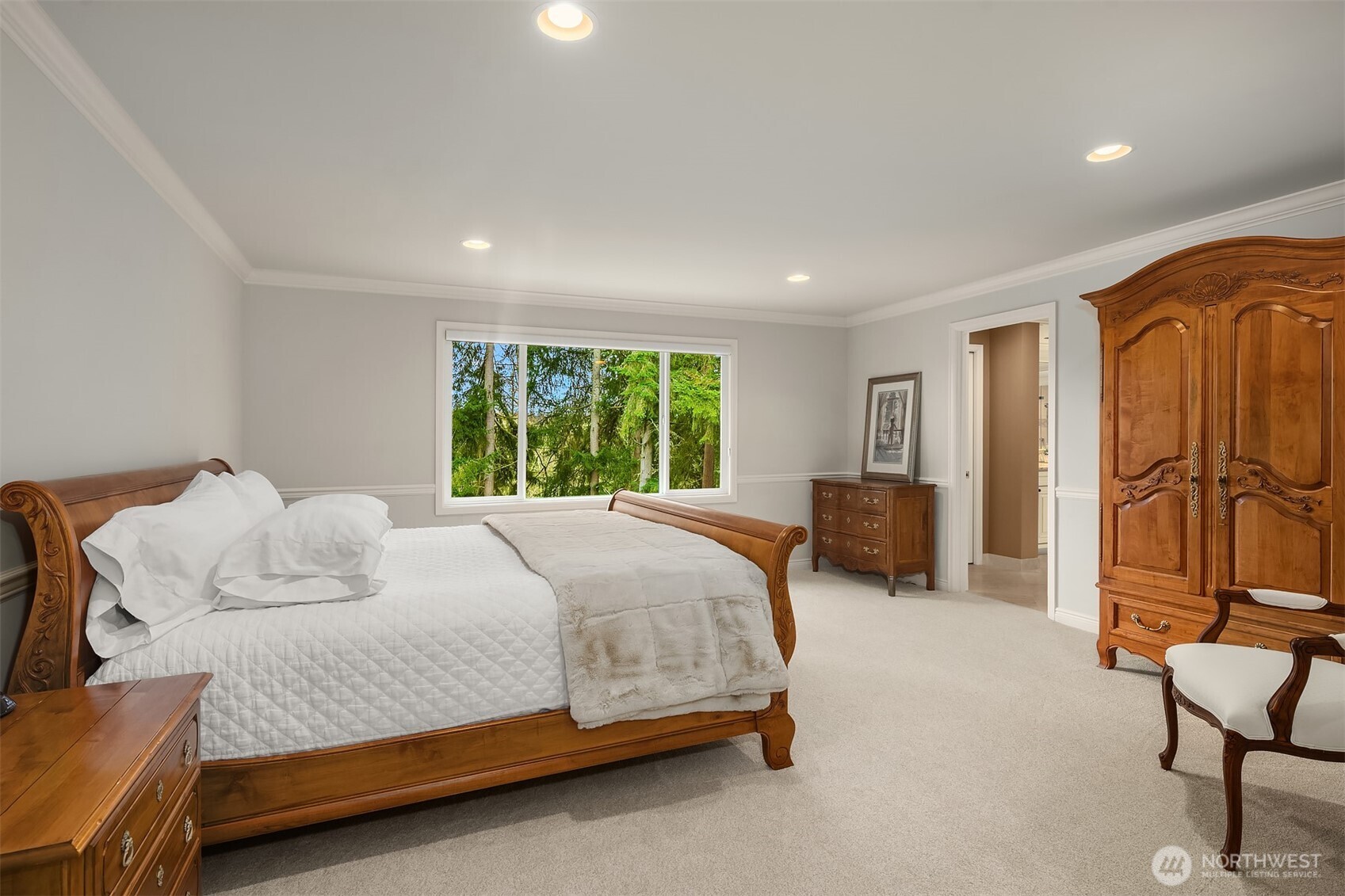 Spacious primary suite ~ serene views of the greenbelt. Large, lavish, spa-inspired en-suite bath with frame-less glass door dual head shower, heated Travertine tile floors, soaking tub, and large walk-in closet.