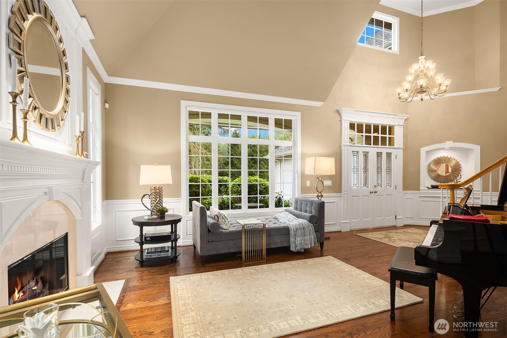 Beautiful wood floors throughout the main level. The floorplan provides flexible and comfortable living, including a den/office and upper-floor bonus room with surround sound.  Dual staircases provide easy access to the upper level.