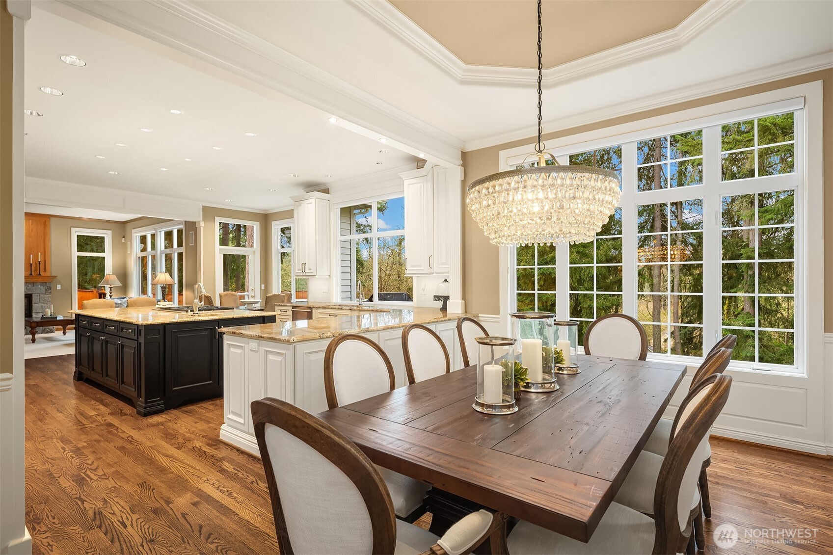 Beautiful wood floors throughout the main level. The floorplan provides flexible and comfortable living, including a den/office and upper-floor bonus room with surround sound.  Dual staircases provide easy access to the upper level.