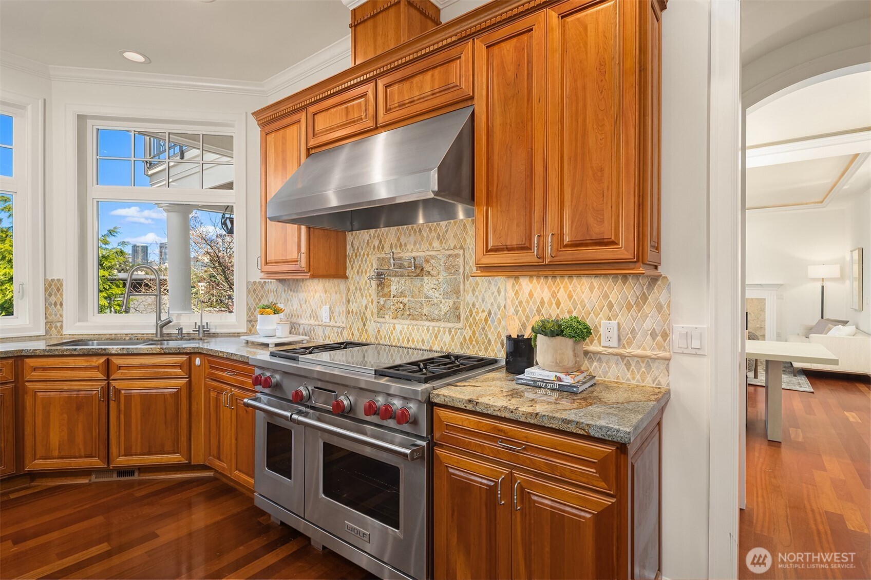 A Wolf oven with a pot filler faucet makes cooking easy.