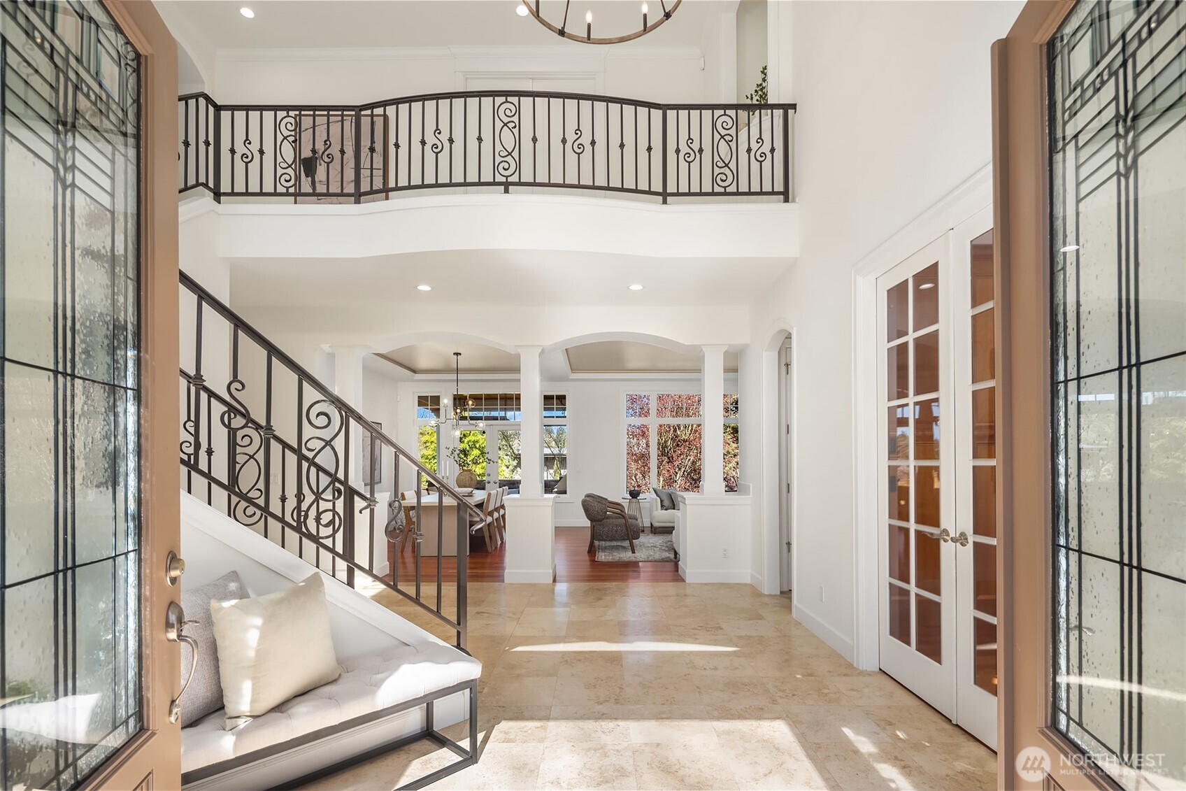 A dramatic curved wrought-iron staircase welcomes you into a two-story foyer, setting the stage for airy, open living spaces designed for today’s lifestyle.