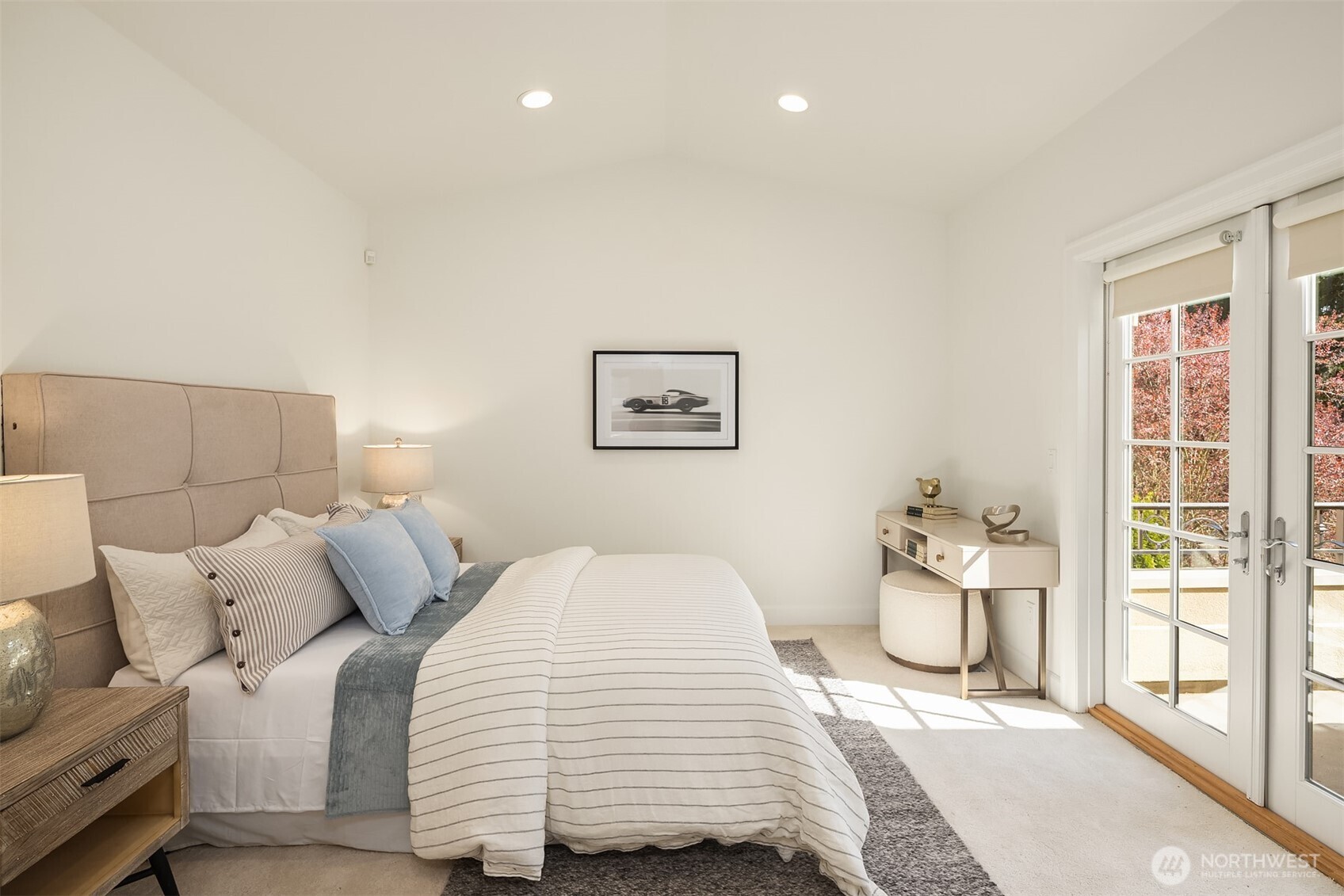 Second upstairs bedroom with French doors.