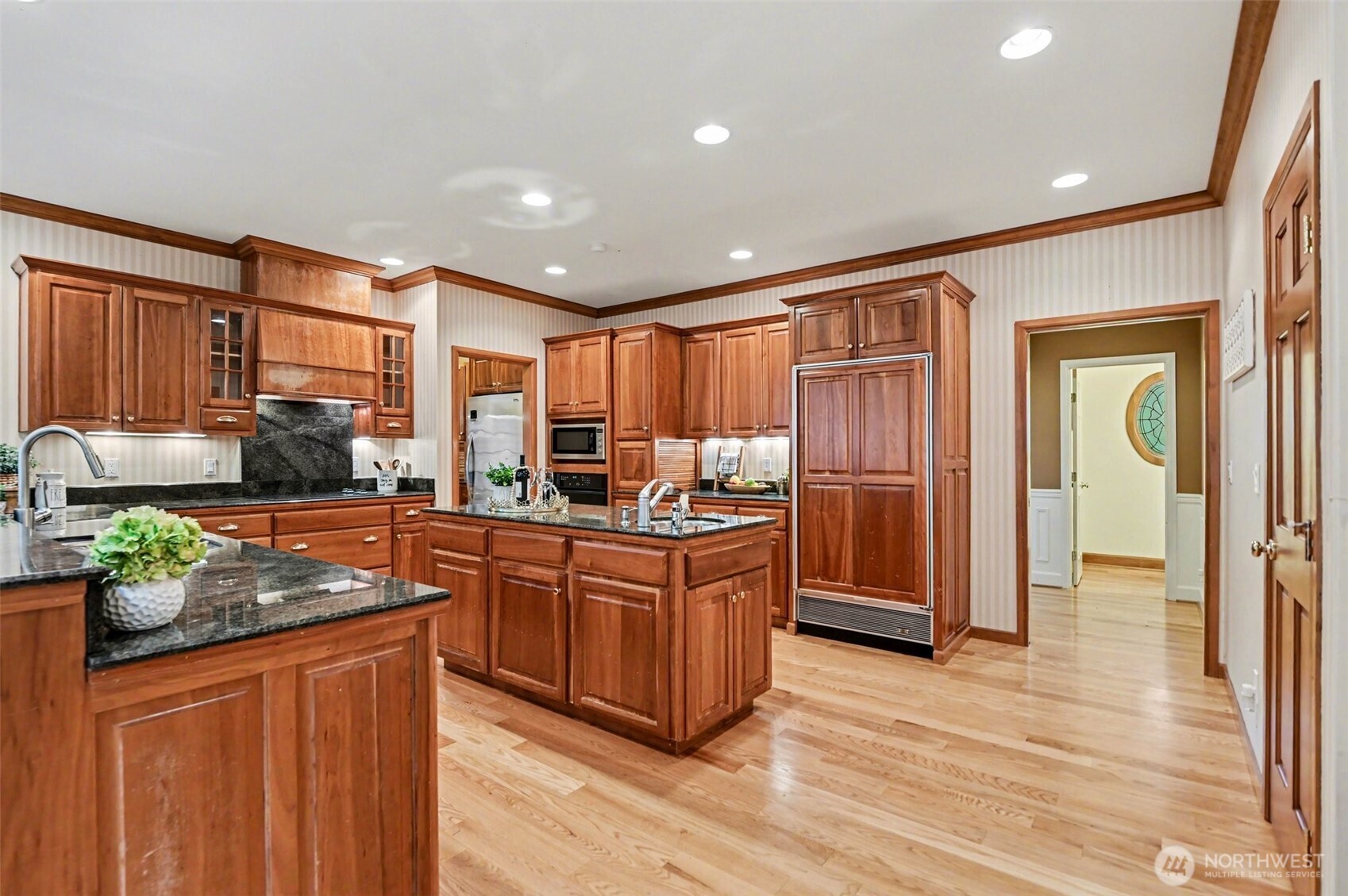 The office is tucked away near the primary suite at the opposite end of the home.