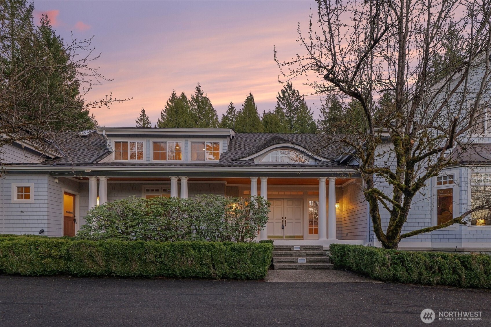 The circular driveway and expansive 3-car garage offers plenty of space for guest parking and the RV or boat.