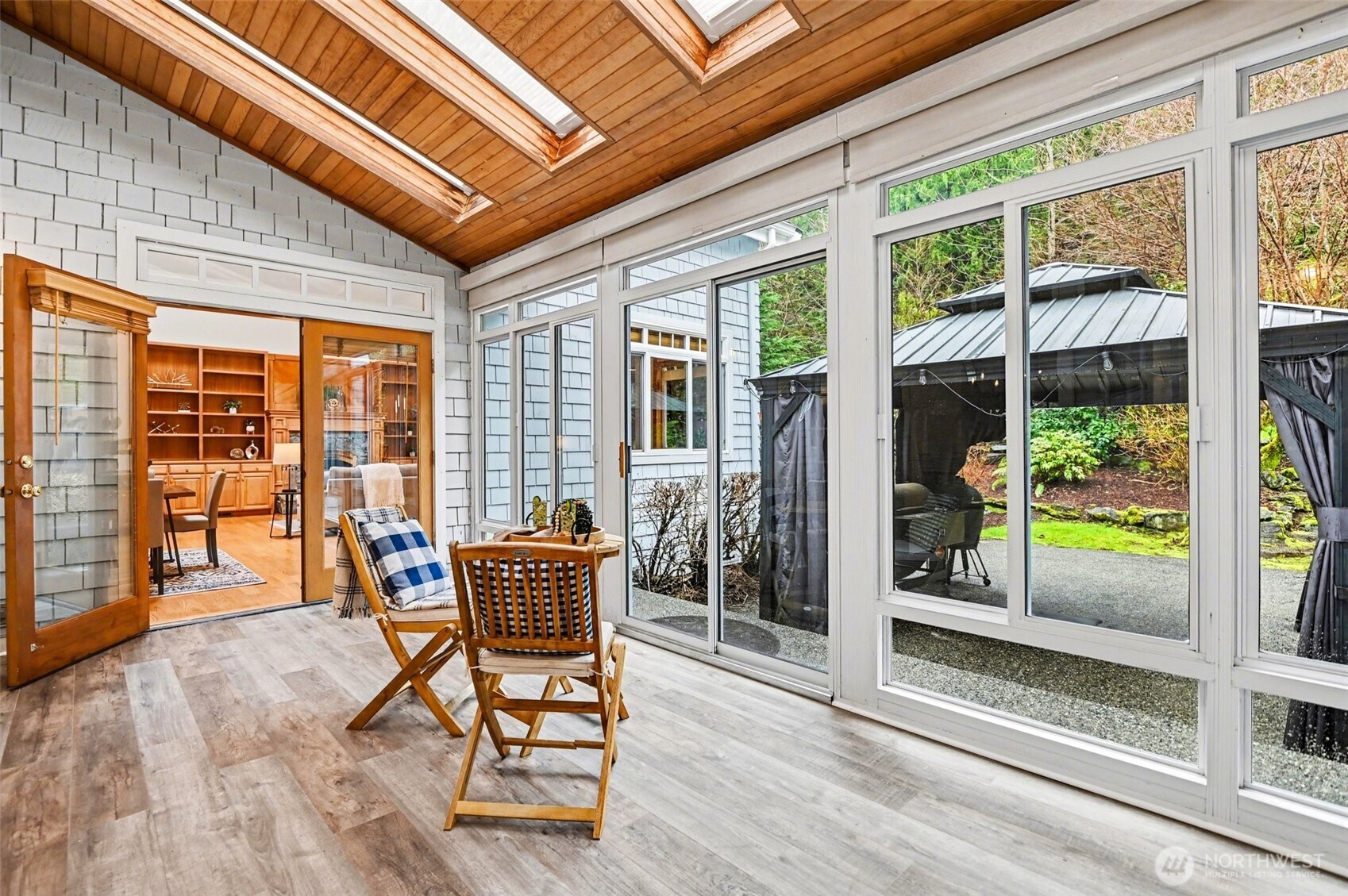 The elegant dining room flows seamlessly to the NEW sunroom.