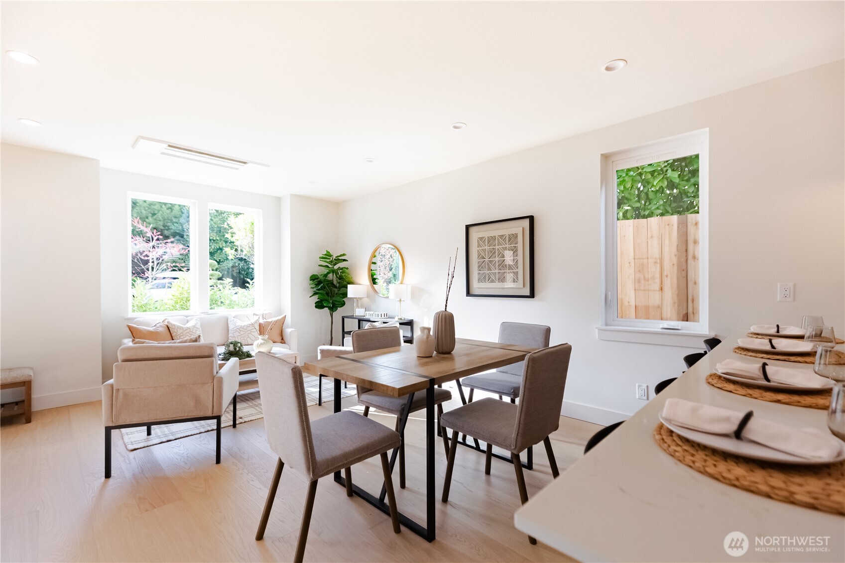 The kitchen feature a large quartz peninsula counter, Bellmont cabinetry, high-end stainless appliances with induction range and loads of storage space.