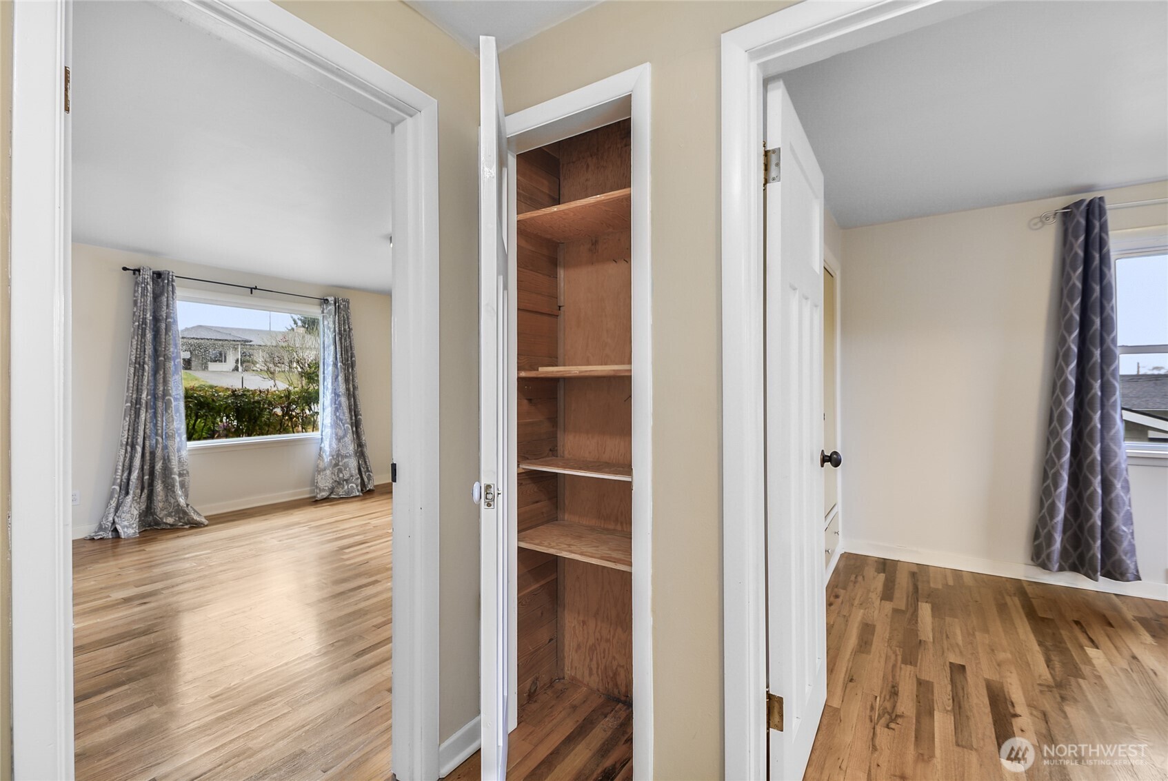 Linen Cupboard in hall between bedrooms