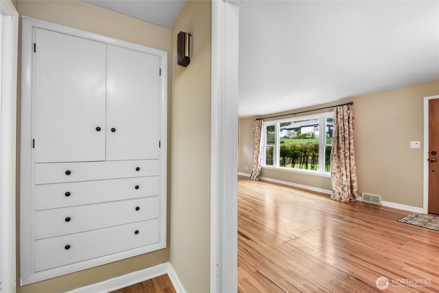 Built-In Cabinetry & Drawers in hallway between Living Room & Kitchen