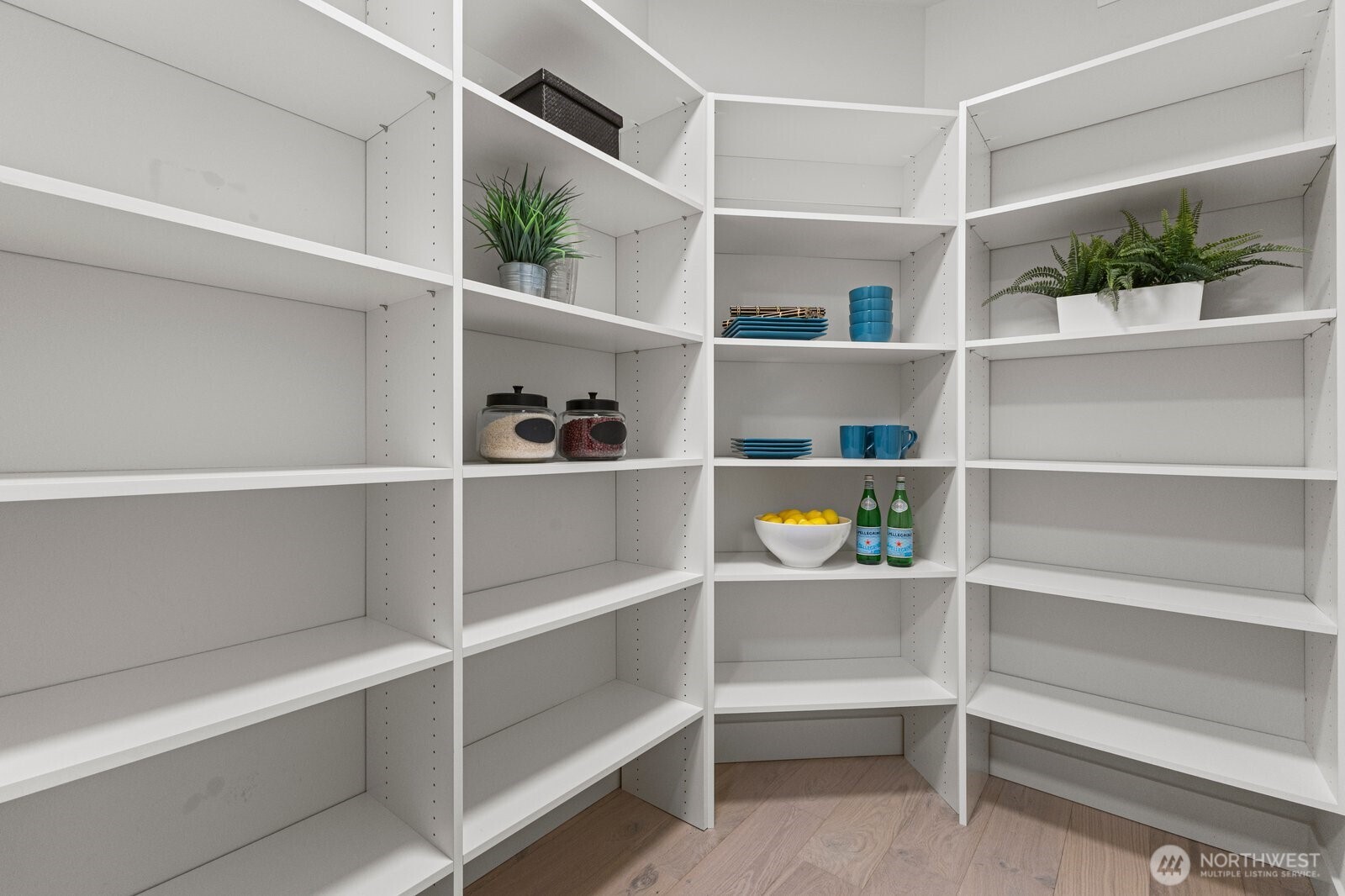 With abundant built-in shelving and exceptional storage, the walk-in pantry is designed to keep the kitchen as functional as it is beautiful.