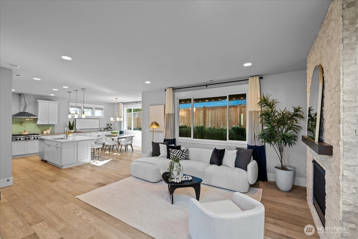 Step inside to open concept living - perfect for entertaining large parties or just enjoying a quiet evening at home.The 9ft ceilings, wood floors and gas fireplace bring warmth and charm to the space.
