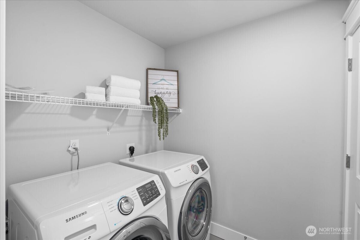 The upstairs laundry room makes staying organized on laundry day a cinche.
