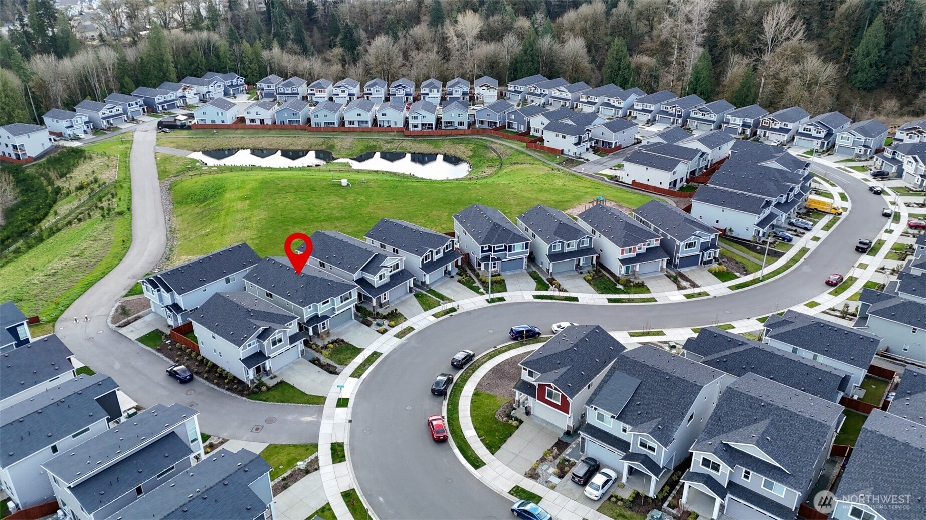 Higher aerial perspective showing the layout of the community and its proximity to nature.