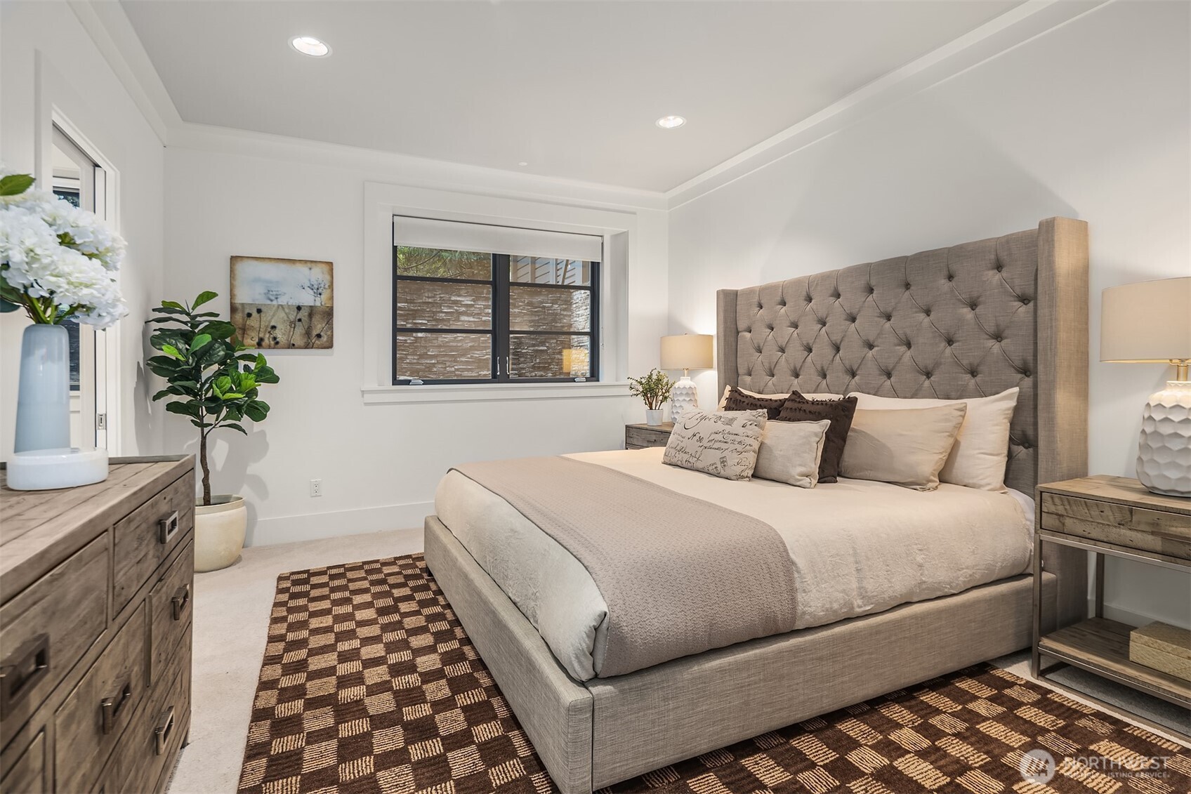 Lower-level bedroom suite with fresh carpet/paint, en-suite bath, and walk-in closet.