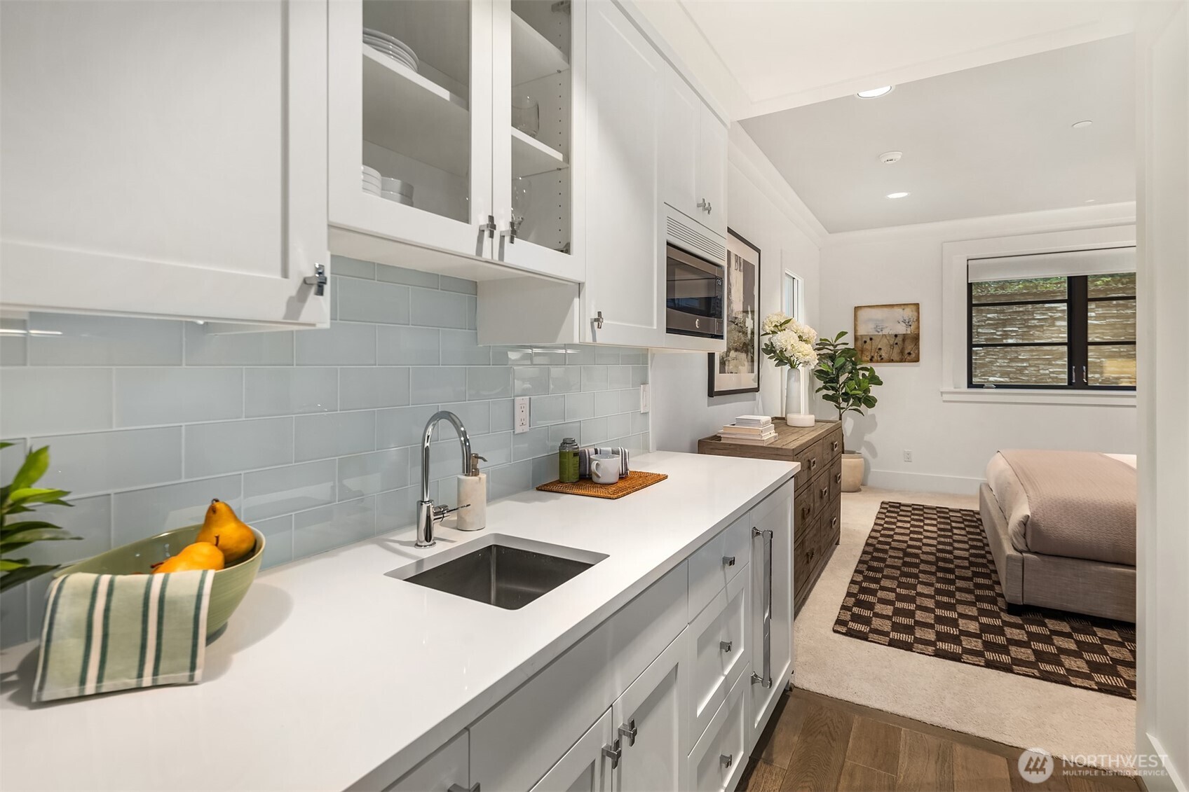 Ideal for guests or an au pair, the lower bedroom includes its own kitchenette.