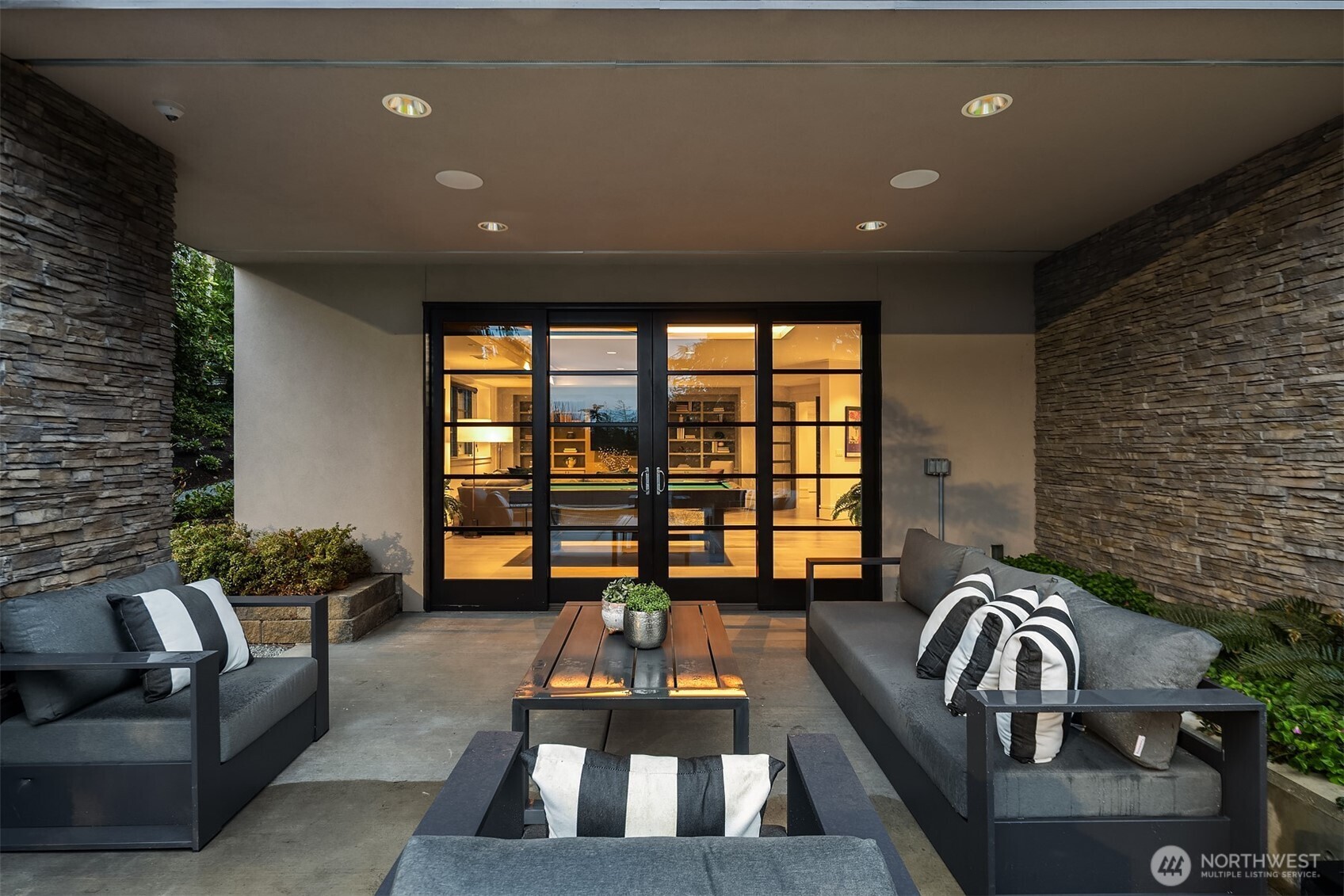 Lower level patio with recessed lighting and in-ceiling speakers.