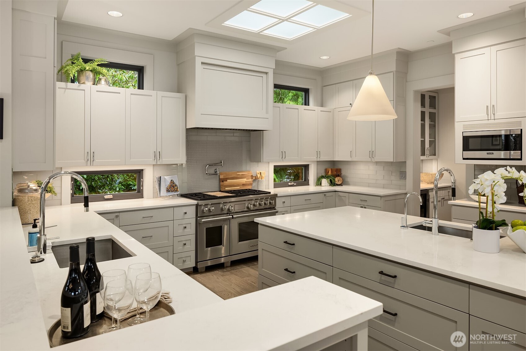 Epicureans will appreciate the grand kitchen, with well-placed windows and a skylight for maximum natural lighting.