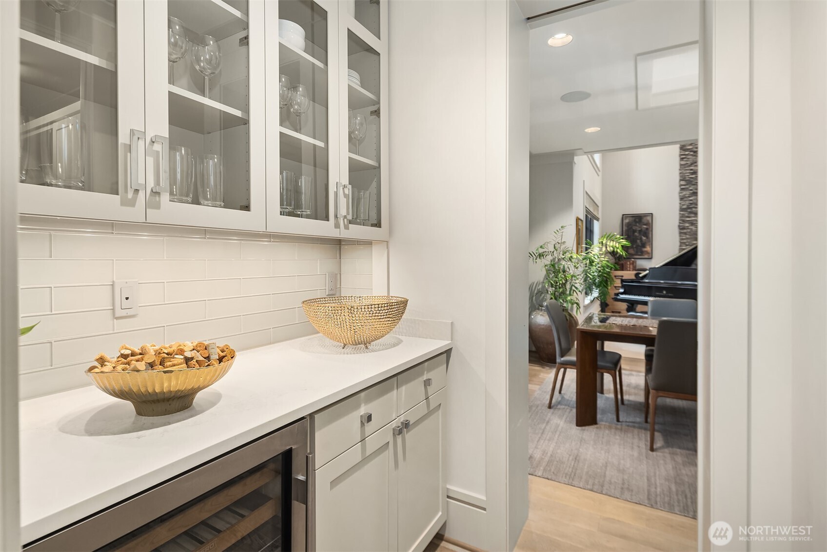 Handy butler's pantry featuring a 36-bottle SubZero wine fridge.