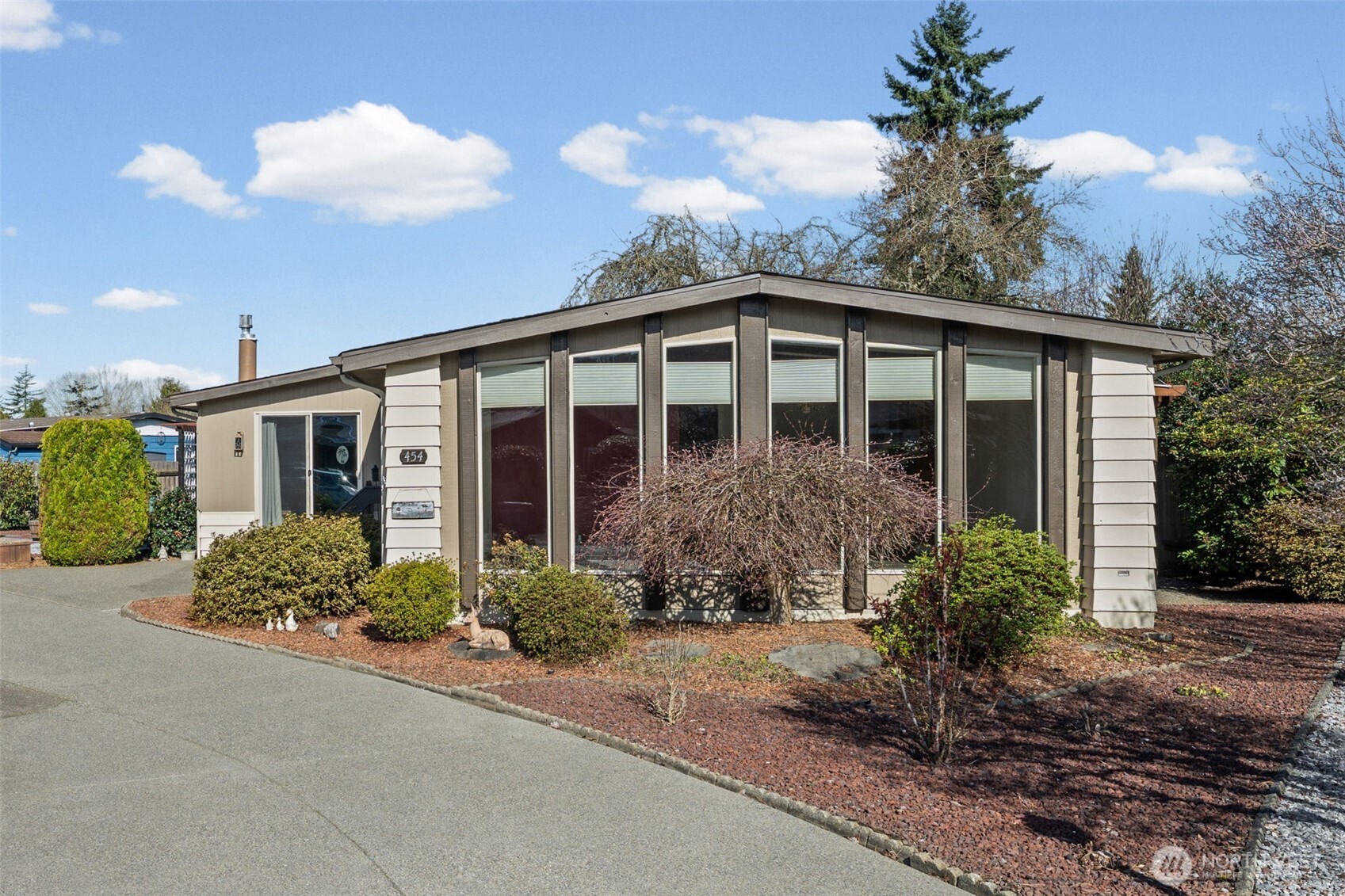 Lot's of windows with an easy care yard.
