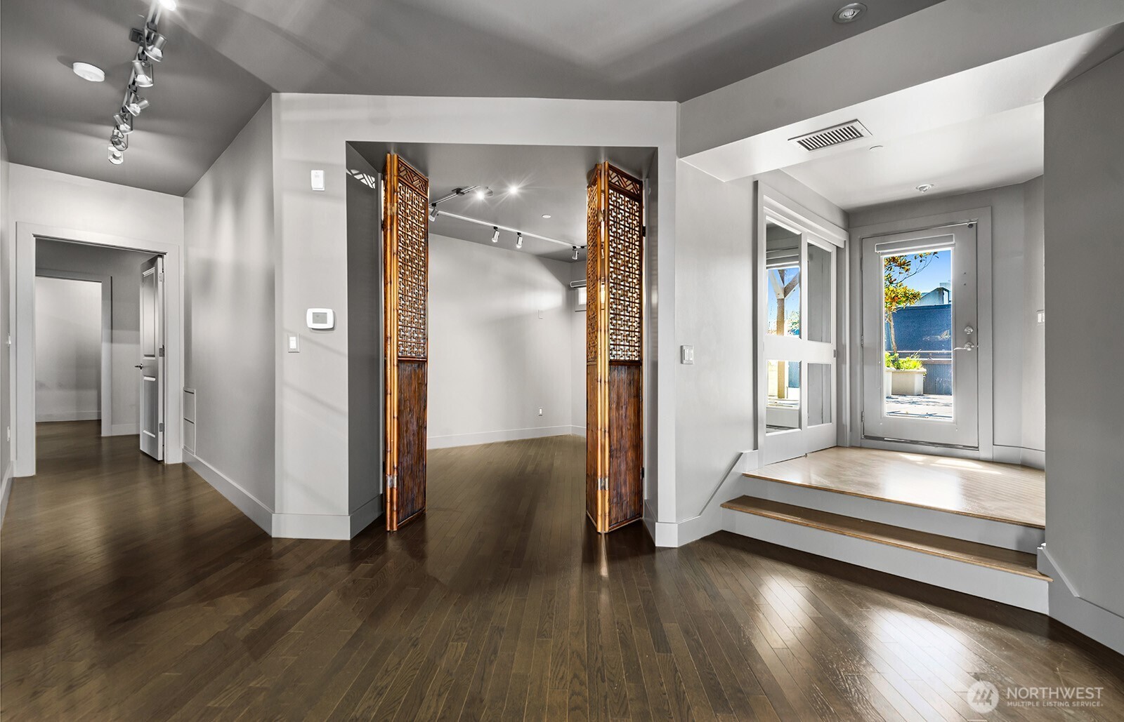 Entry looking into the third bedroom used as office/den (no legal egress).