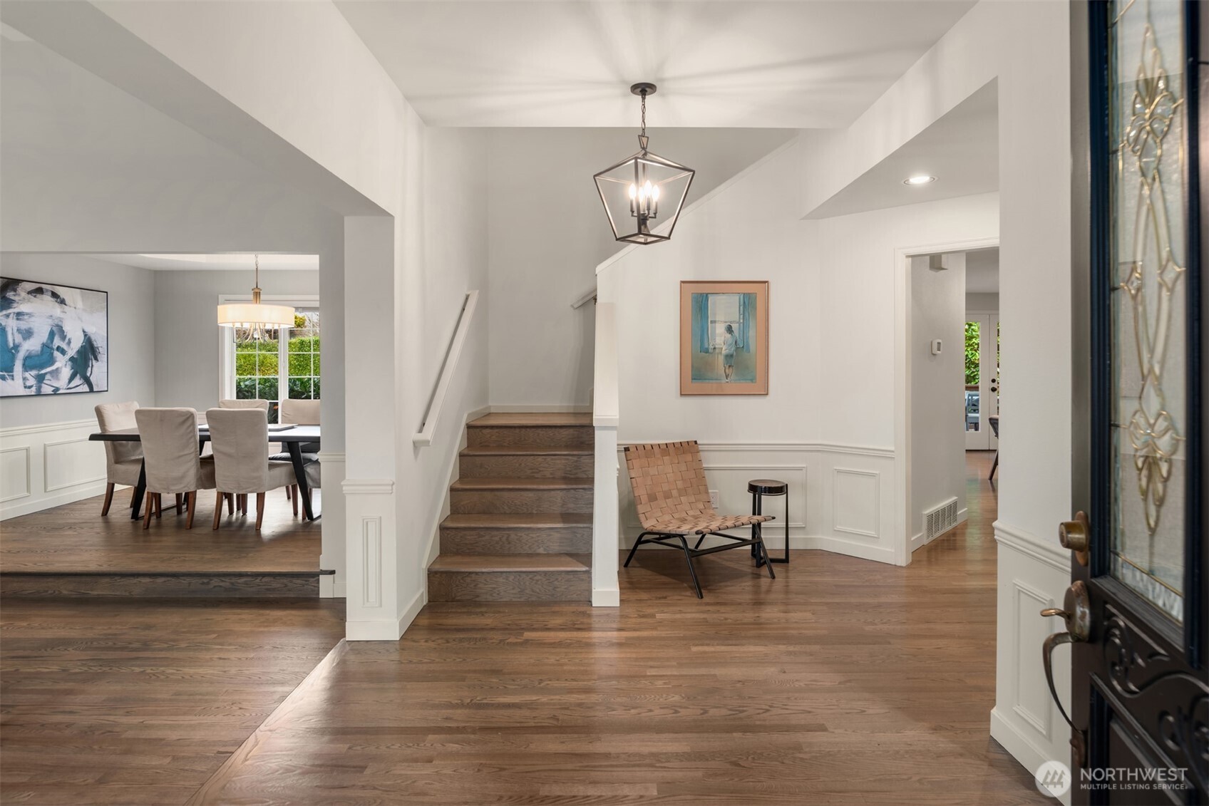 Welcoming Entry with Rich Oak Hardwoods, Fresh Paint and Upgraded Lighting