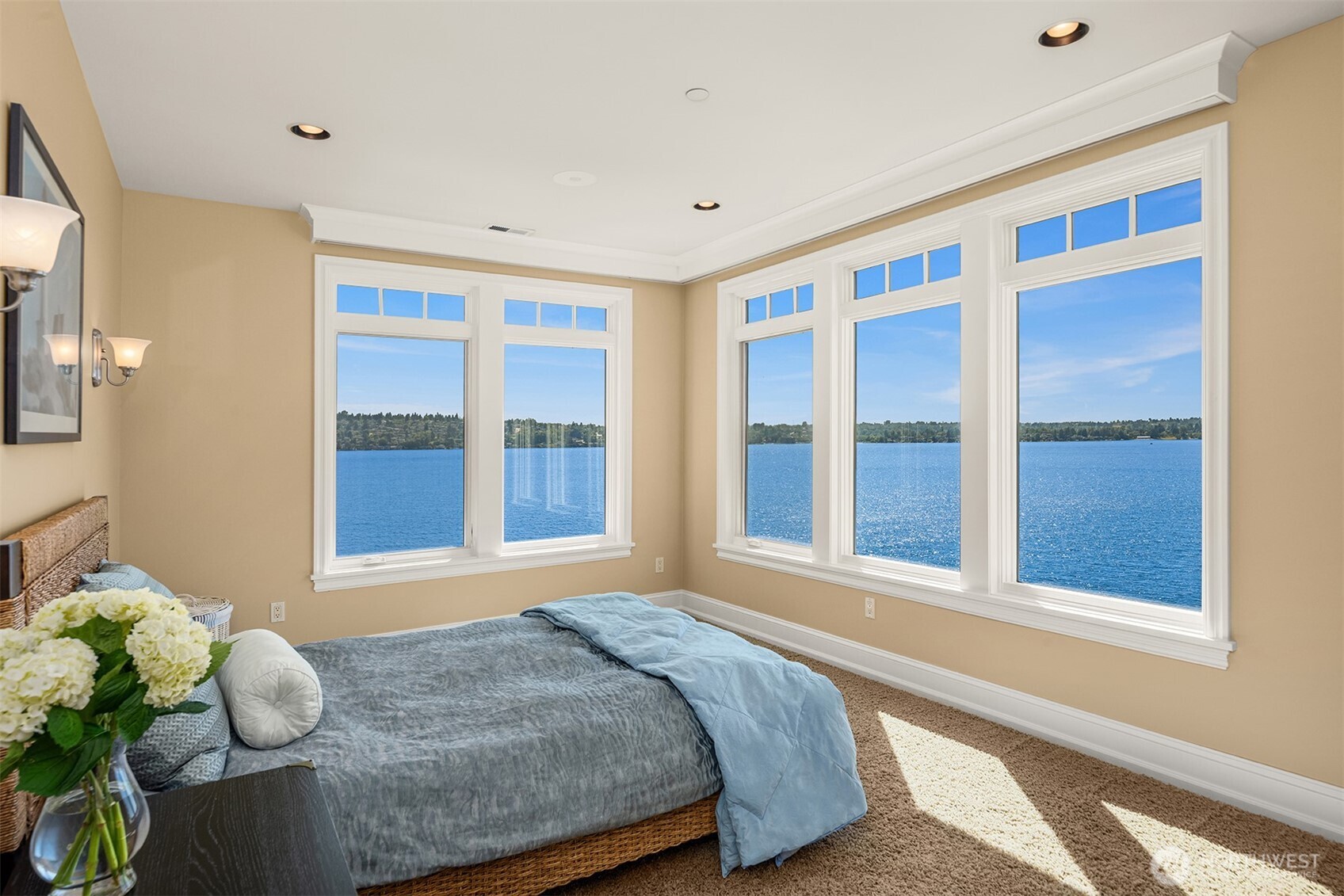 Full bar with expansive views of lake, mirror/tv on bar wall.