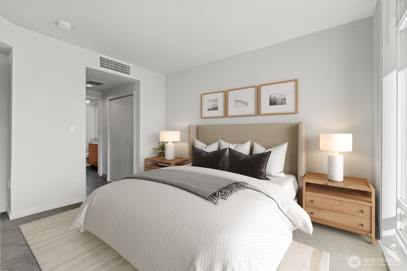 Primary bedroom w/ ensuite bath & own balcony (virtually staged)