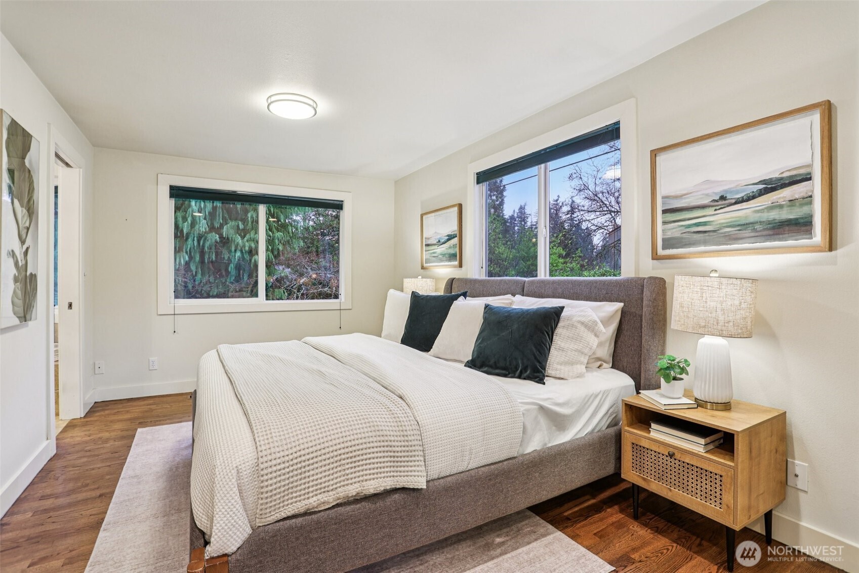 The primary bedroom is one of two bedrooms on the main level, with plenty of space and great natural light.