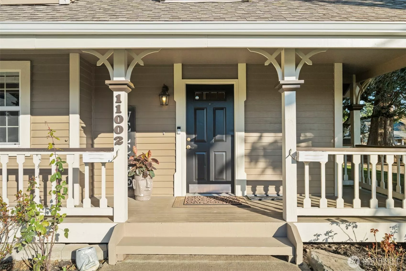 The expansive front porch is the perfect place for rocking chairs, morning coffee, and enjoying time with loved ones and fur babies in the fully fenced yard.
