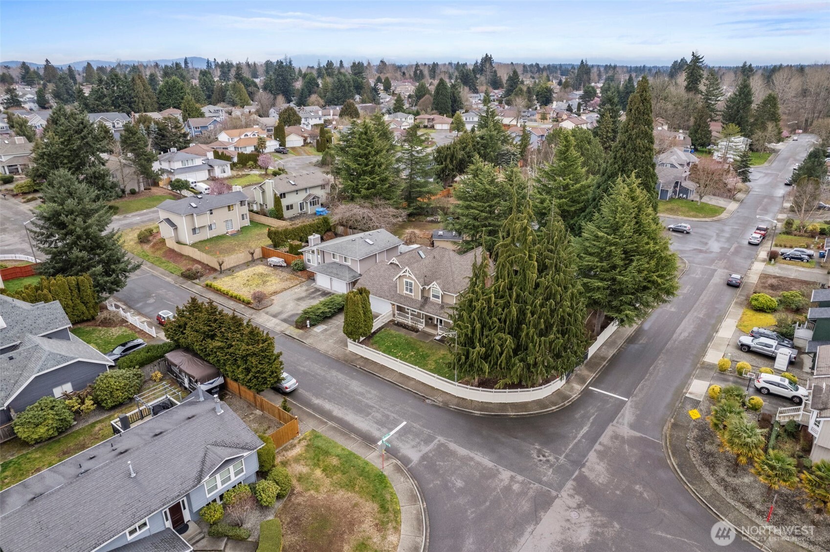 Set on an expansive 8,498 sq ft corner lot, this fully fenced property offers both privacy and flexible outdoor living—an uncommon find on Kent’s East Hill.