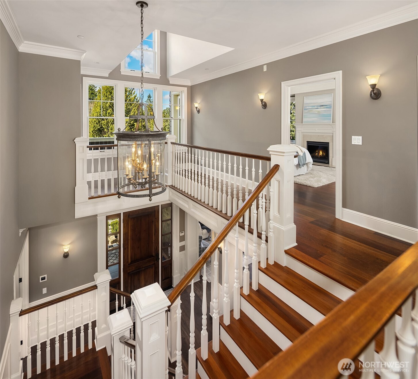 Grand stairway upstairs to 4 bedrooms.