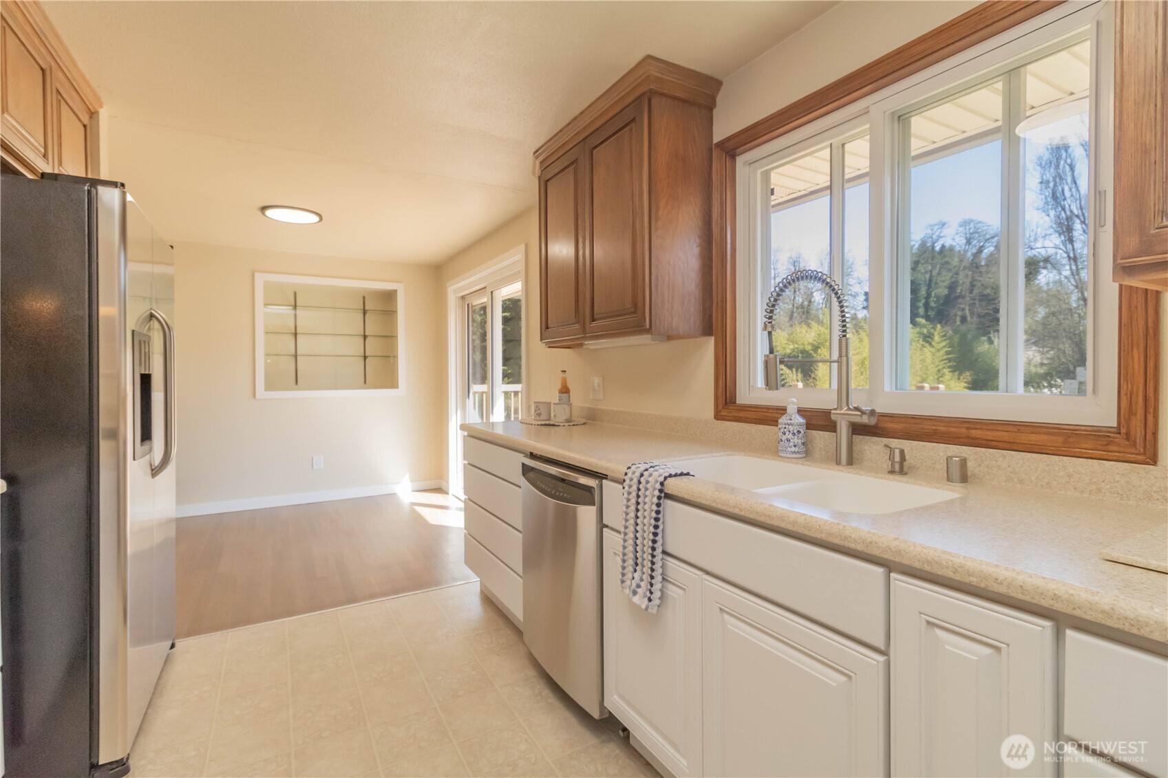 Great window and slider with sweeping view of the deck and back yard