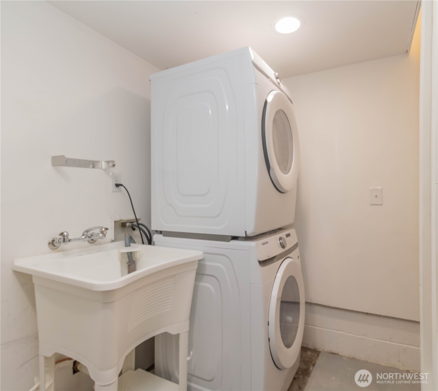 Full size stacked front loading washer and dryer with utility sink