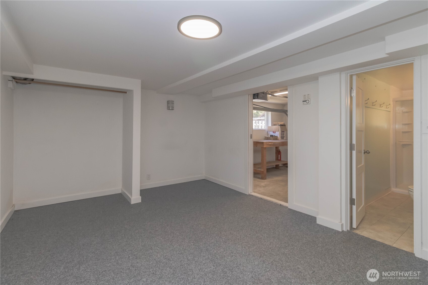 Additional flex space with door to shop area and fully updated bathroom with walk-in shower