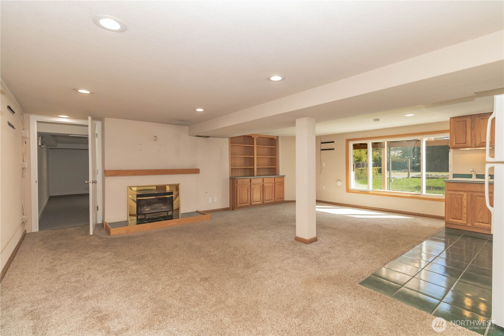 Natural gas insert for those cold nights. Storage galore with built-ins and kitchen cabinetry