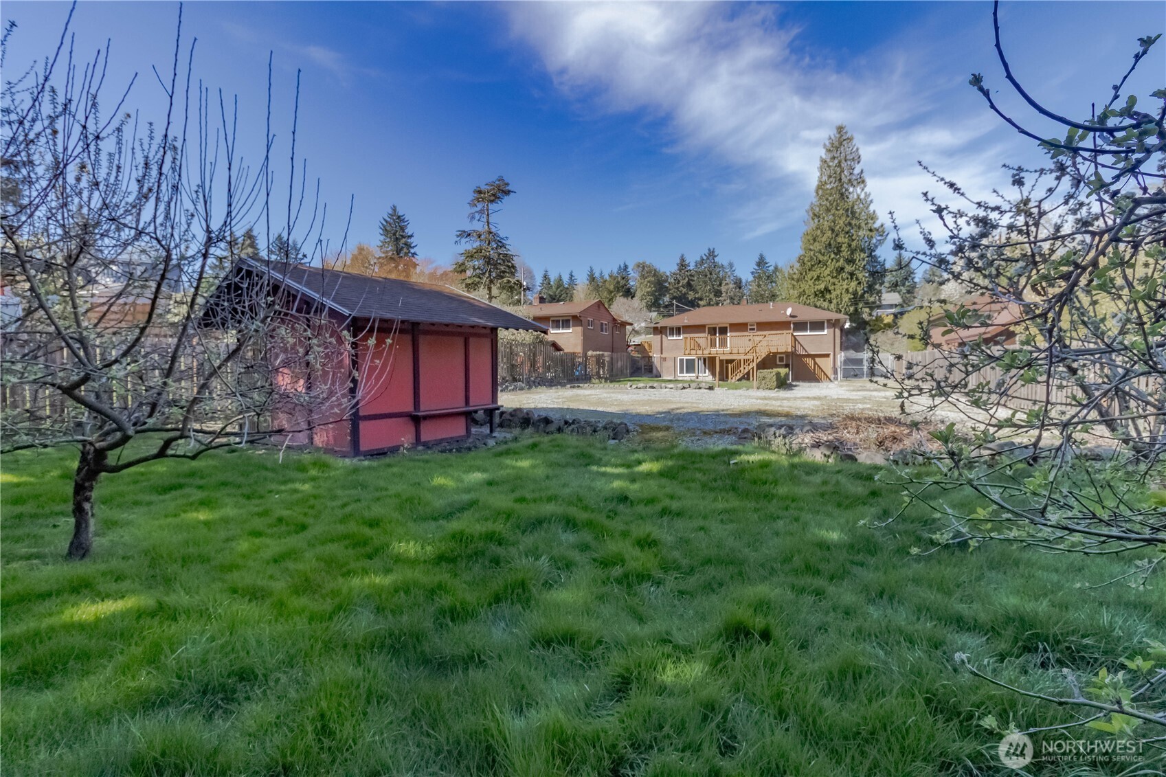View from end of property looking back towards the house, more grassy area