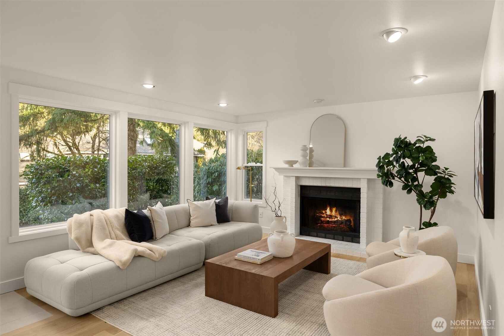 Family room off kitchen has an updated cozy fireplace