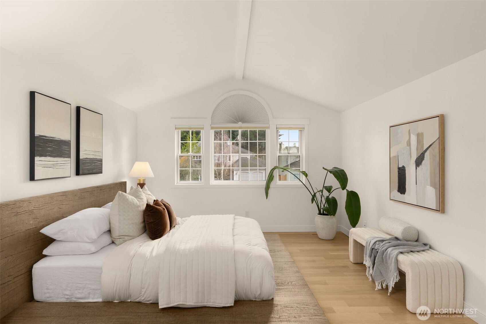 Primary suite has vaulted ceilings