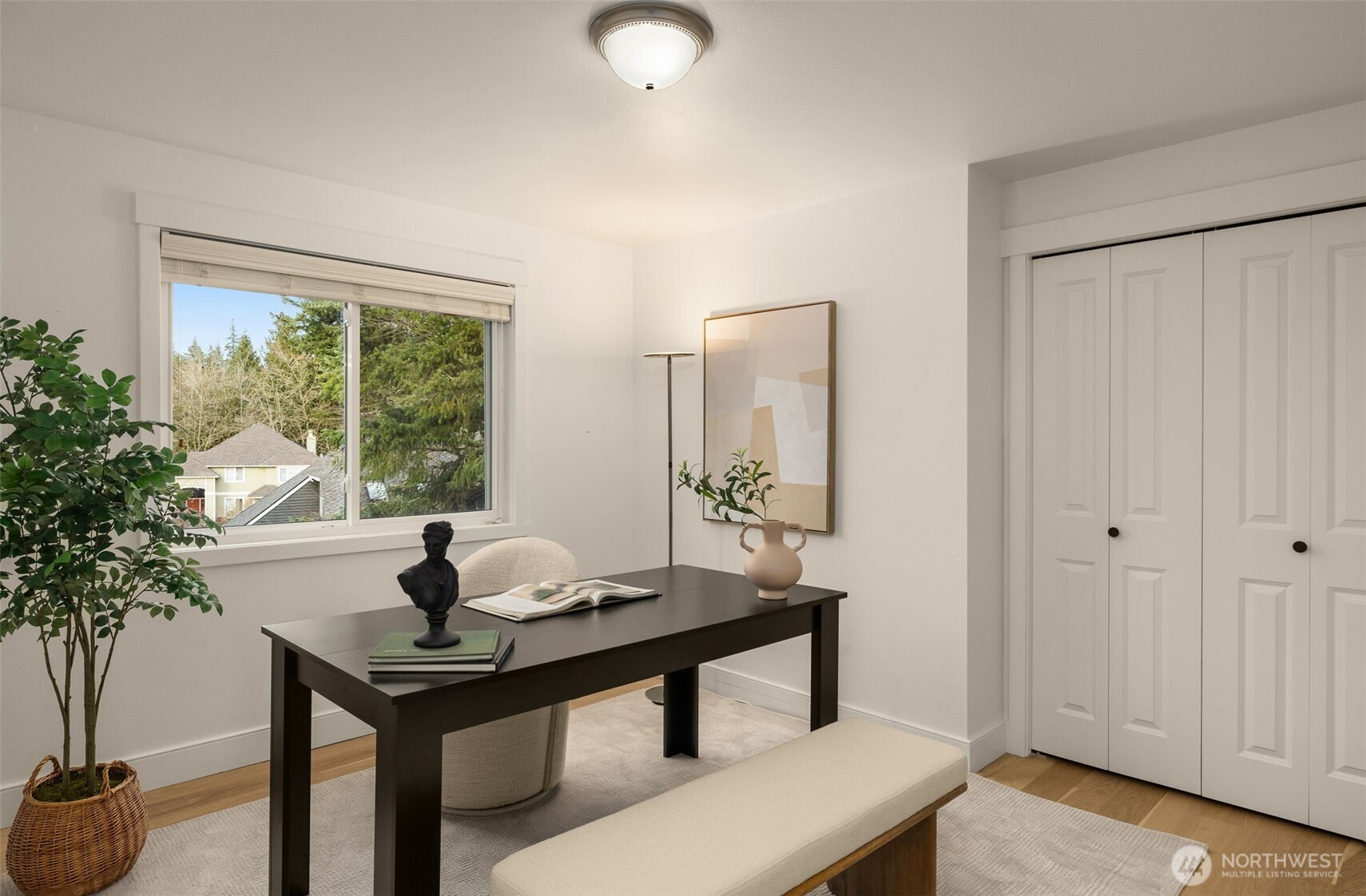 1 of 4 generous bedrooms is currently staged as an office