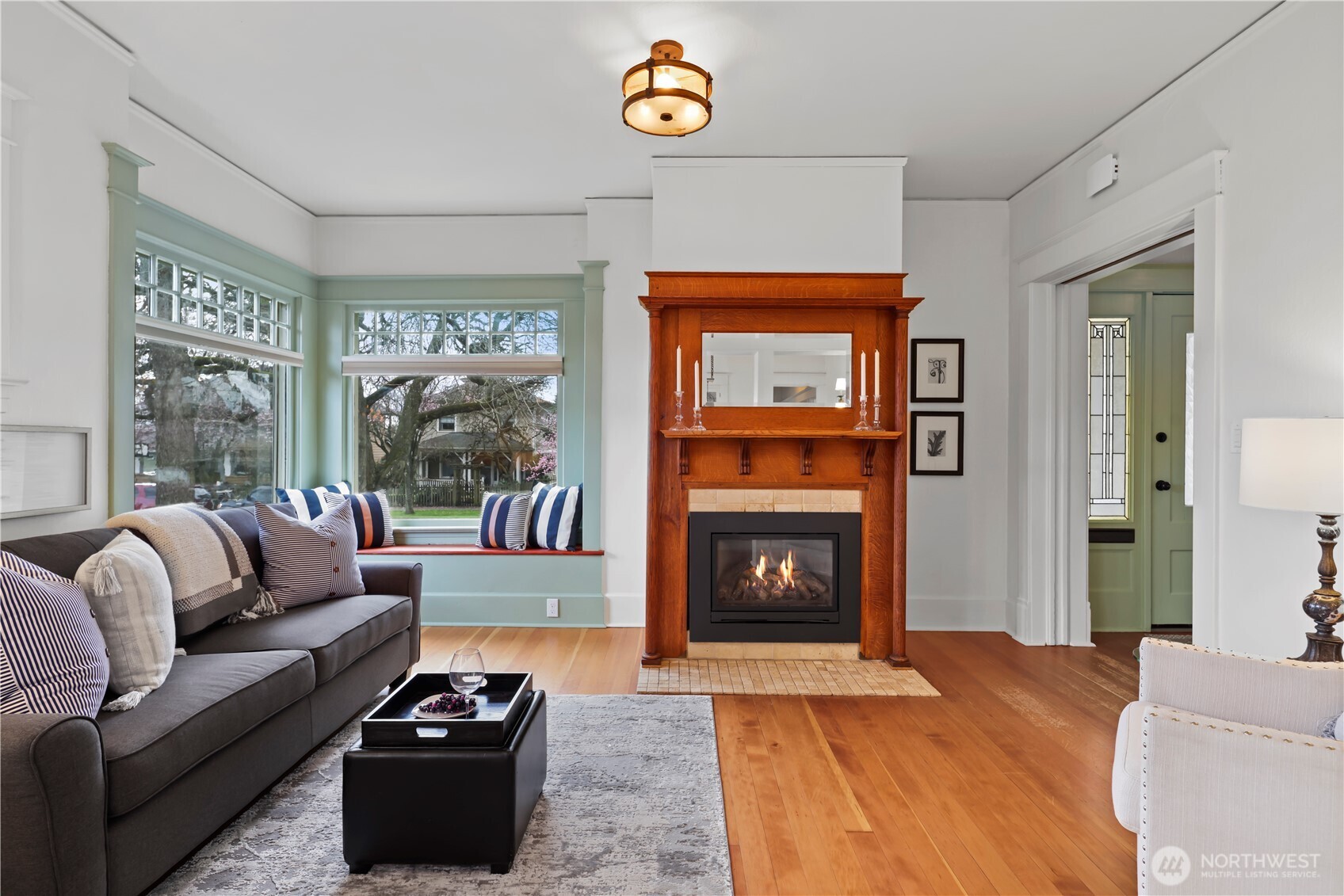 Cozy gas fireplace and fabulous corner window.