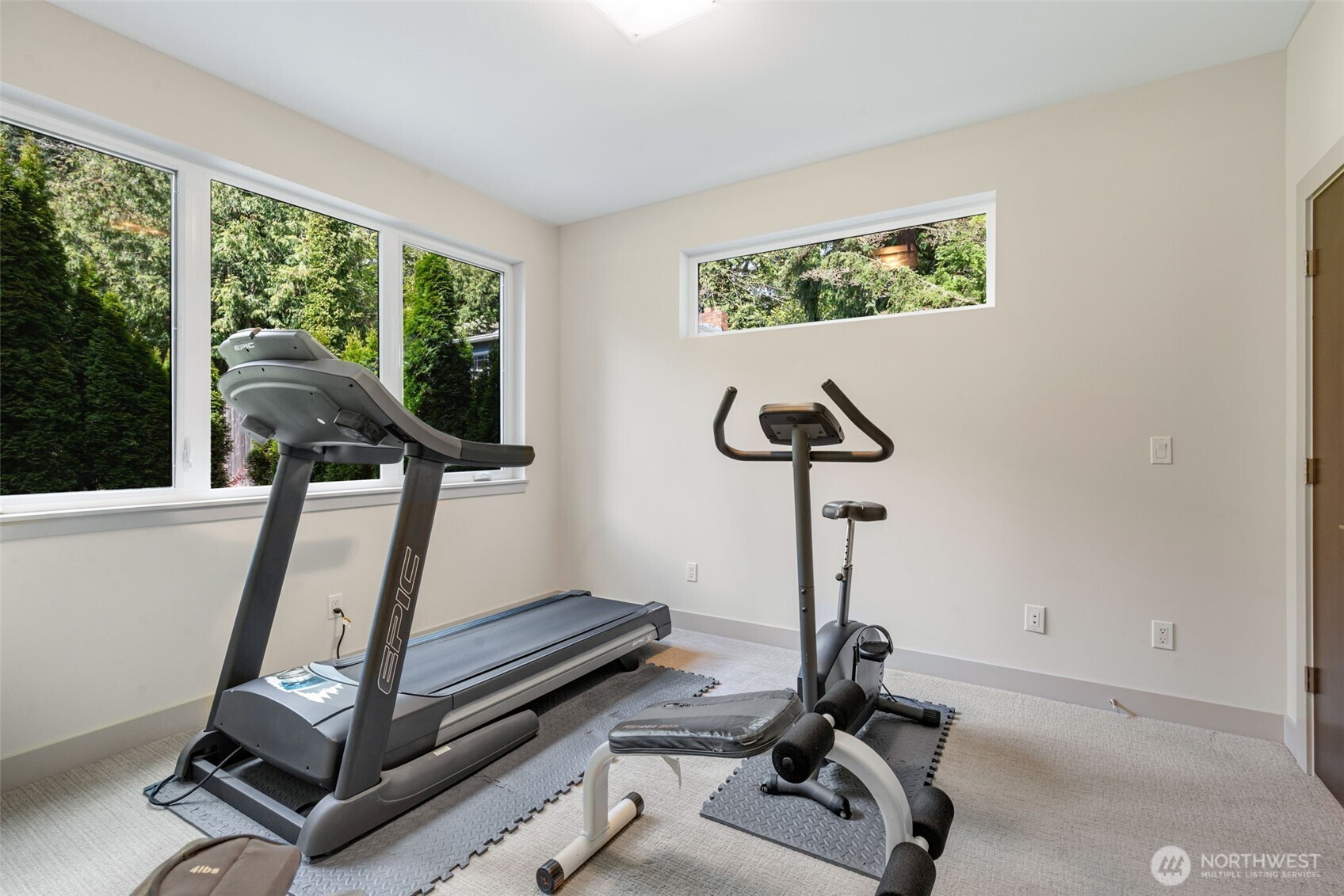 One of 4 private bedrooms, this one currently being used as a fitness room.